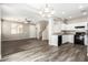 Open-concept layout seamlessly connects the living room, dining area, and kitchen at 925 E Agua Fria Ln, Avondale, AZ 85323