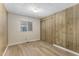 Bedroom with wood laminate flooring and a window with blinds at 9501 E Broadway Rd # Ofc, Mesa, AZ 85208