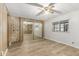 Bright bedroom with mirrored closet doors and built in dresser and storage cabinets at 9501 E Broadway Rd # Ofc, Mesa, AZ 85208