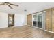 Cozy living area with wood-look floors and sliding glass doors for easy access to the outside patio at 9501 E Broadway Rd # Ofc, Mesa, AZ 85208