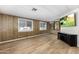 Spacious living room with wood-look floors, large windows, and views of the beautiful neighborhood at 9501 E Broadway Rd # Ofc, Mesa, AZ 85208