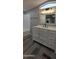 Bright bathroom features white vanity, framed mirror, updated fixtures, and a shower and tub combination at 9632 E Arbor Cir, Mesa, AZ 85208