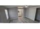 A bedroom featuring new flooring, walk-in closet, ceiling fan and attached bathroom with vanity at 9632 E Arbor Cir, Mesa, AZ 85208