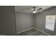 Neutral bedroom with updated floors, ceiling fan, and a window for natural light at 9632 E Arbor Cir, Mesa, AZ 85208