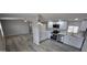 Open floor plan featuring stainless steel appliances, modern countertops, and recessed lighting at 9632 E Arbor Cir, Mesa, AZ 85208
