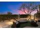 Inviting backyard oasis with a hammock and mature tree against a colorful sunset at 9675 E Roadrunner Dr, Scottsdale, AZ 85262