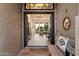 Inviting entryway view to the living room with natural light and stylish decor throughout at 9675 E Roadrunner Dr, Scottsdale, AZ 85262