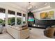 Elegant living room with a modern fireplace, stylish lighting, and access to outdoor views at 9675 E Roadrunner Dr, Scottsdale, AZ 85262