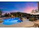 Stunning backyard with a custom pool, spa, and outdoor seating under a vibrant sky at 9675 E Roadrunner Dr, Scottsdale, AZ 85262