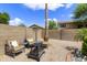 Low-maintenance backyard featuring desert landscaping, seating, and a fire pit at 1072 W Windhaven Ave, Gilbert, AZ 85233