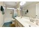 Clean bathroom featuring a double vanity, tub and shower combo with decorative tiling at 1072 W Windhaven Ave, Gilbert, AZ 85233