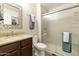 Bathroom featuring a vanity with sink, toilet, and a glass-enclosed shower at 1072 W Windhaven Ave, Gilbert, AZ 85233