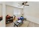 Bedroom containing workout equipment, carpeted floors, and a ceiling fan at 1072 W Windhaven Ave, Gilbert, AZ 85233