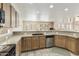 Bright kitchen with granite countertops, stainless steel appliances, and ample storage space at 1072 W Windhaven Ave, Gilbert, AZ 85233