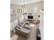Two-story living room with neutral colors, large windows, and plenty of natural light at 1072 W Windhaven Ave, Gilbert, AZ 85233