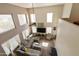 Two-story living room with neutral colors, large windows, and plenty of natural light at 1072 W Windhaven Ave, Gilbert, AZ 85233