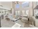 Bright and airy living room with large windows, neutral tones, and comfortable seating at 1072 W Windhaven Ave, Gilbert, AZ 85233