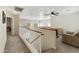 Second-floor landing with a seating area, billiards table, and view of the staircase at 1072 W Windhaven Ave, Gilbert, AZ 85233