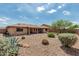 Expansive backyard featuring low-maintenance desert landscaping, a covered patio, and desert landscape at 10940 E Olla Ave, Mesa, AZ 85212