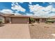 Charming home featuring a large driveway, desert landscaping, and a two-car garage at 10940 E Olla Ave, Mesa, AZ 85212