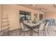 Covered patio area perfect for outdoor dining with comfortable seating and stylish decor at 10940 E Olla Ave, Mesa, AZ 85212