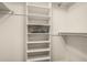 This walk-in closet features a built-in shelving and towel stack at 10940 E Olla Ave, Mesa, AZ 85212