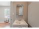 A white sink and mirror bathroom space with light gray walls at 1128 E Phelps St, Gilbert, AZ 85295