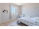 Bedroom featuring bed, desk, and large window with neighborhood view at 1128 E Phelps St, Gilbert, AZ 85295