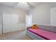 Bedroom with daybed, closet, and white wainscoting at 1128 E Phelps St, Gilbert, AZ 85295
