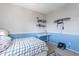 Bedroom with light-colored walls, comfortable bed, and desk workspace at 1128 E Phelps St, Gilbert, AZ 85295