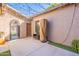 Relaxing outdoor space is decorated with string lights and an iron archway to the backyard at 1128 E Phelps St, Gilbert, AZ 85295
