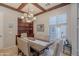 Dining room featuring wood beams, chandelier, seating for six, and built in storage at 1128 E Phelps St, Gilbert, AZ 85295