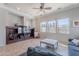 Bright living room featuring built-in shelving and tile flooring at 1128 E Phelps St, Gilbert, AZ 85295