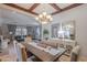 Spacious dining room open to a living room featuring modern furnishings and decor at 1128 E Phelps St, Gilbert, AZ 85295