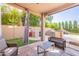 Covered patio with outdoor kitchen and backyard view at 1128 E Phelps St, Gilbert, AZ 85295