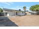 Large backyard with an unfinished yard, mature trees, and a covered patio at 1205 W 7Th St, Tempe, AZ 85281