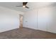 Spacious bedroom with carpet, a ceiling fan, sliding closet doors, and an ensuite bathroom at 1205 W 7Th St, Tempe, AZ 85281