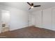 Bedroom with ceiling fan, closet, ensuite access, and bathroom view at 1205 W 7Th St, Tempe, AZ 85281