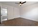 Bright bedroom featuring neutral carpet, white walls, and a ceiling fan with a light at 1205 W 7Th St, Tempe, AZ 85281