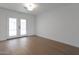 Bright bedroom with hardwood floors and a glass door for outdoor access at 1205 W 7Th St, Tempe, AZ 85281