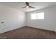Well-lit bedroom with carpet, a ceiling fan, a closet, and a large window at 1205 W 7Th St, Tempe, AZ 85281