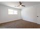 Bright bedroom features a ceiling fan, closet, window, and ensuite access at 1205 W 7Th St, Tempe, AZ 85281