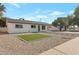 Well-maintained exterior with desert landscaping and a small patch of green grass at 1205 W 7Th St, Tempe, AZ 85281