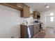 Well-equipped kitchen with stainless steel appliances, quartz countertops, and wood cabinets at 1205 W 7Th St, Tempe, AZ 85281