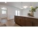 Modern kitchen featuring a peninsula, hardwood floors, and stainless steel appliances at 1205 W 7Th St, Tempe, AZ 85281