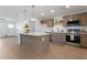 Bright, open kitchen with island, stainless appliances, and stylish cabinets at 1205 W 7Th St, Tempe, AZ 85281