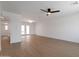 Spacious living room featuring hardwood floors, ceiling fan and a glass patio door at 1205 W 7Th St, Tempe, AZ 85281
