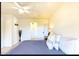 Bright bedroom featuring a ceiling fan and a view of the entryway at 13280 W Caribbean Ln, Surprise, AZ 85379