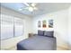 Cozy bedroom with a double bed, a window, and three pieces of artwork at 13280 W Caribbean Ln, Surprise, AZ 85379