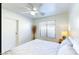 Well-lit bedroom including a ceiling fan, and a bright window at 13280 W Caribbean Ln, Surprise, AZ 85379